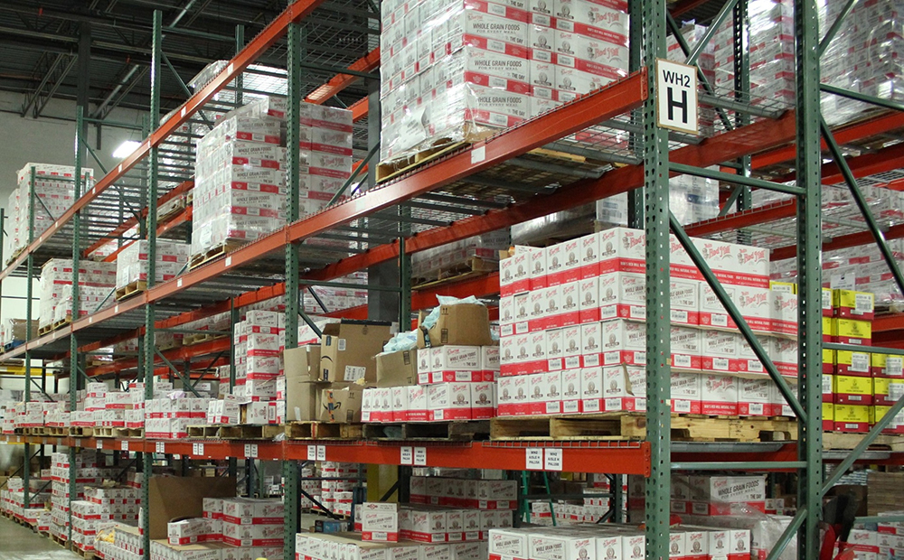 Warehouse shelving filled with neatly organized product boxes ready for distribution